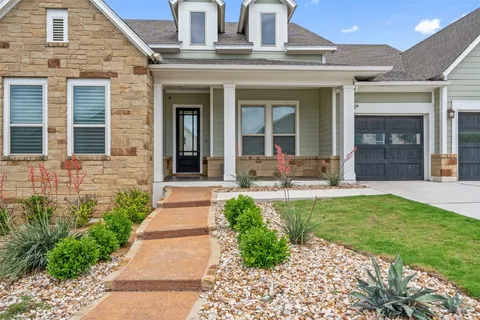 a view of the house with a yard