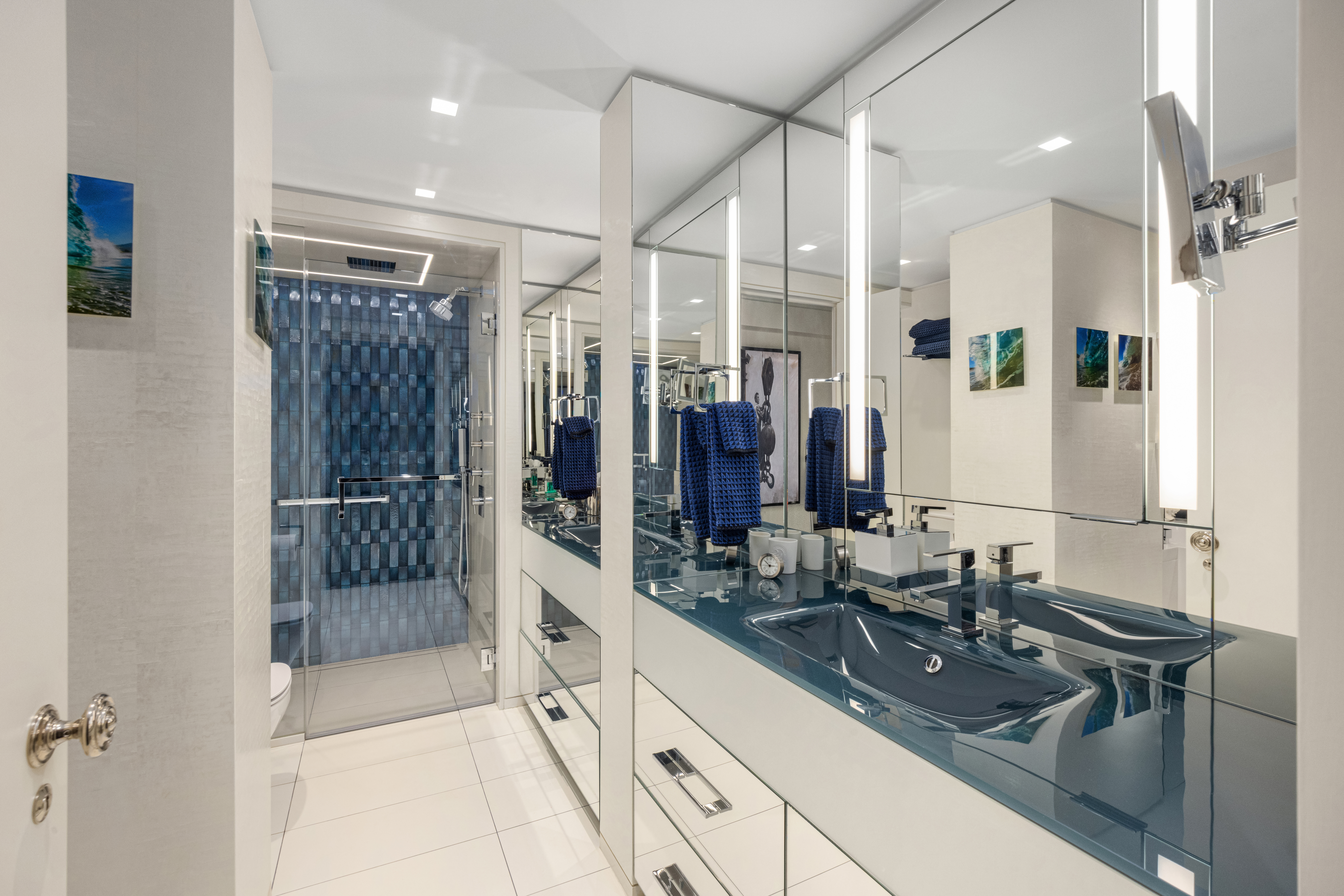 150 West 56th Street, Unit 3901 Manhattan, NY 10019 - Photo 16 of 25 a bathroom with a shower sink and mirror