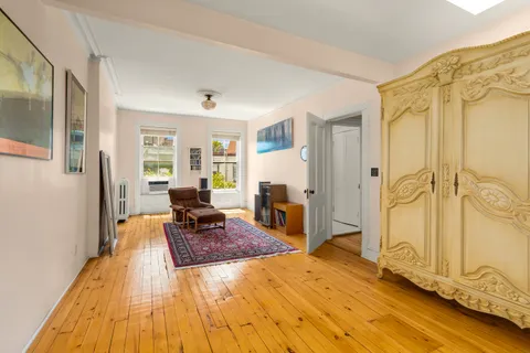 a spacious bathroom with a tub shower and window