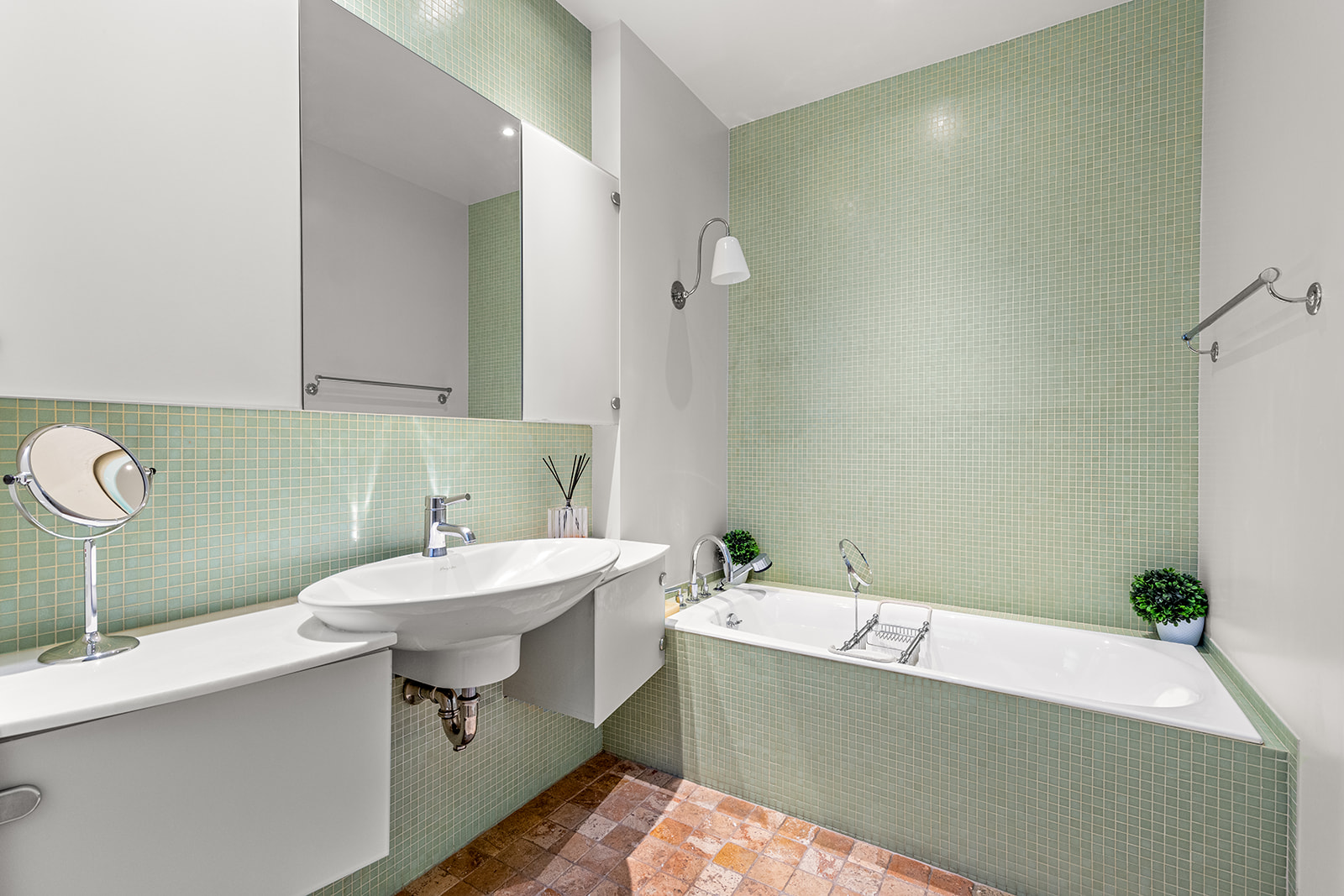 40 East 62nd Street, Unit 6E Manhattan, NY 10065 - Photo 20 of 25 a bathroom with a sink a toilet and a mirror