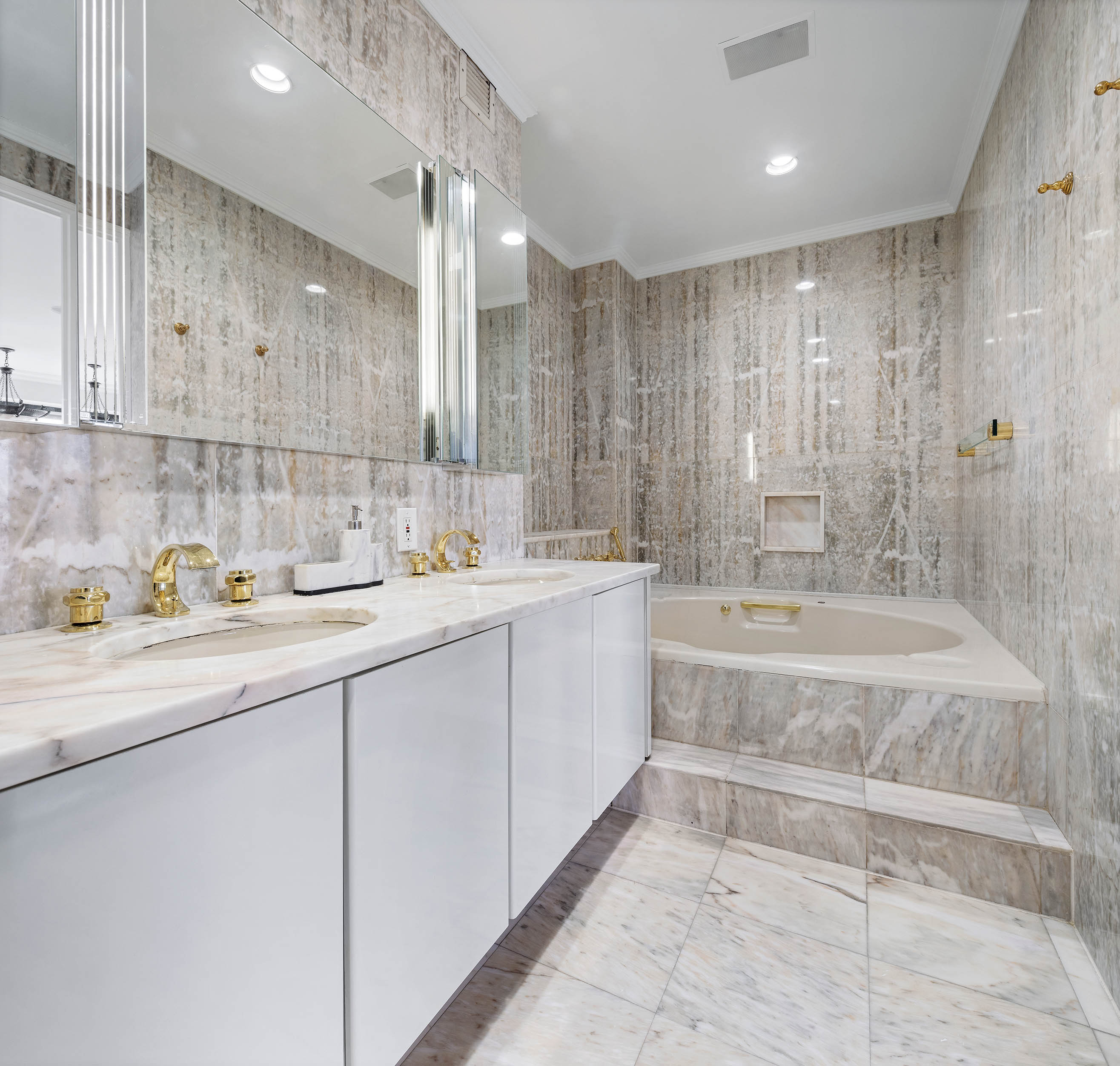 530 East 76th Street, Unit PH36/37E Manhattan, NY 10021 - Photo 14 of 29 a spacious bathroom with a granite countertop sink mirror and bathtub