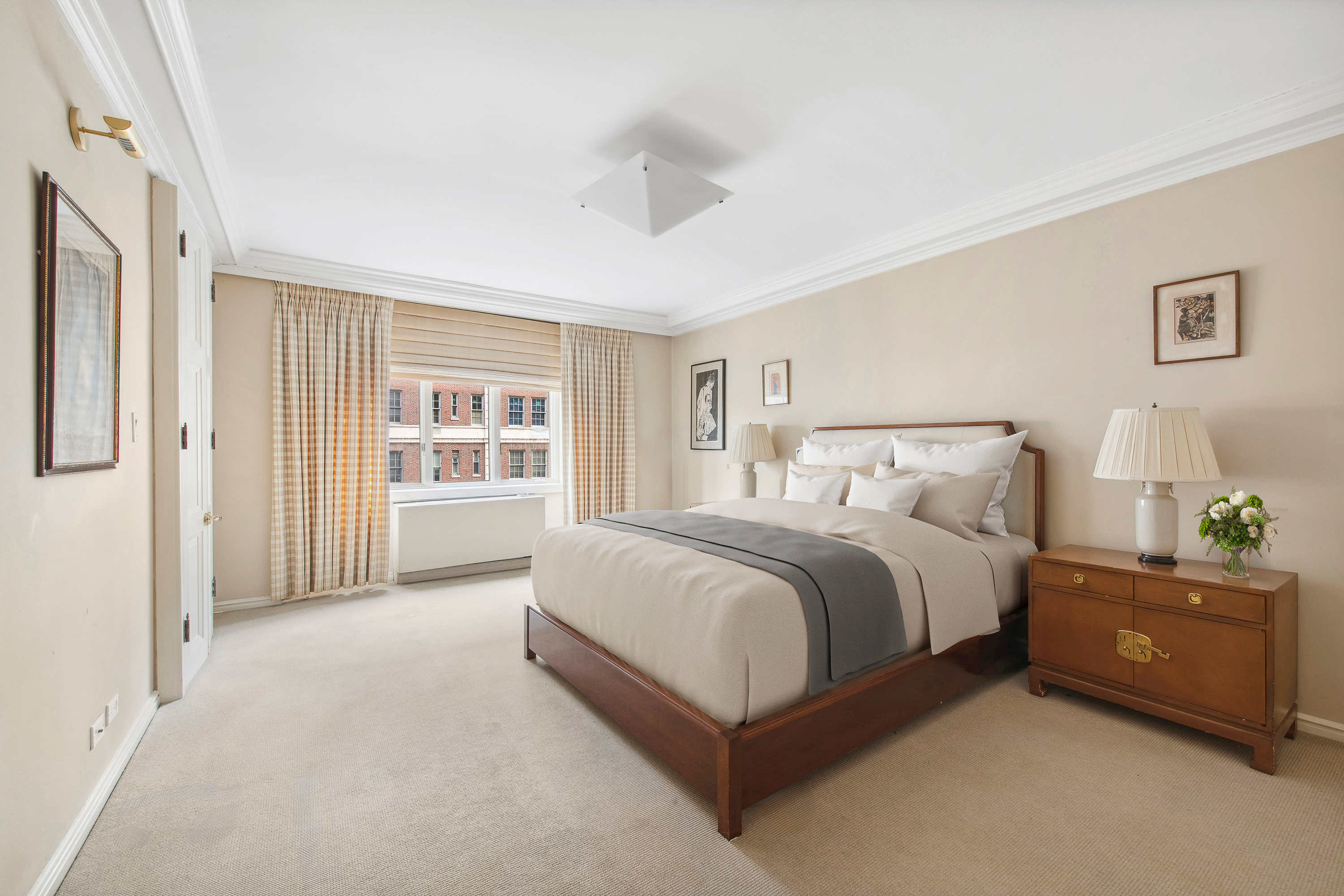 2 Sutton Place South, Unit 7F Manhattan, NY 10022 - Photo 8 of 18 a spacious bedroom with a bed and a window