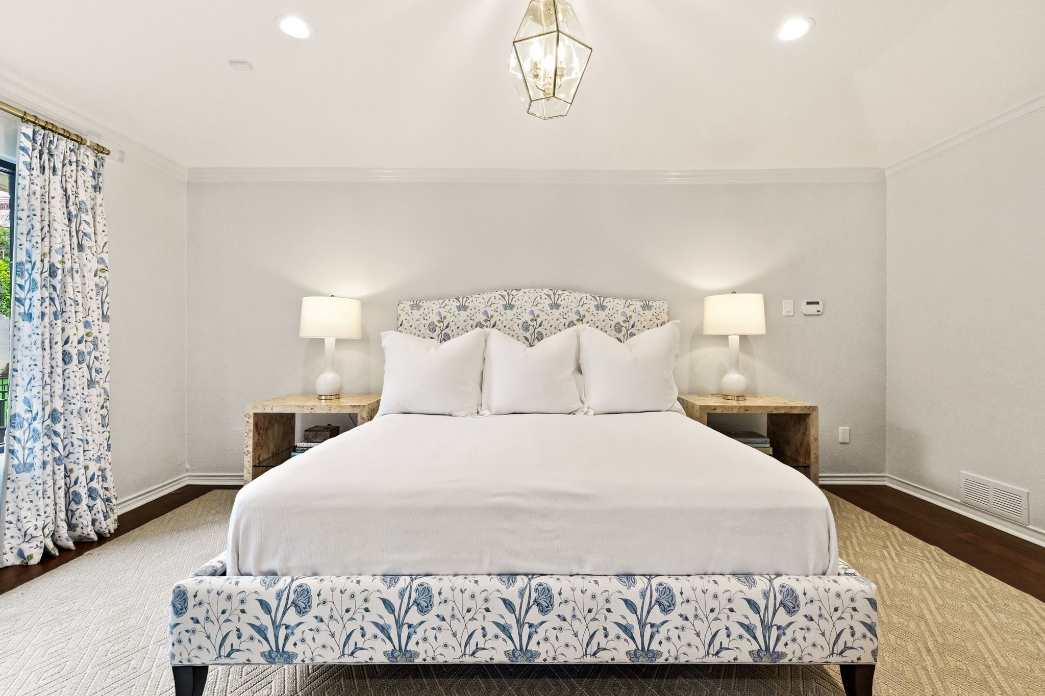 5765 Stonegate Road Dallas, TX 75209 - Photo 21 of 37 a bedroom with a bed and a window