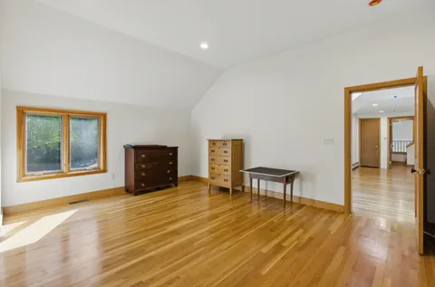 a view of a livingroom with furniture and wooden floor