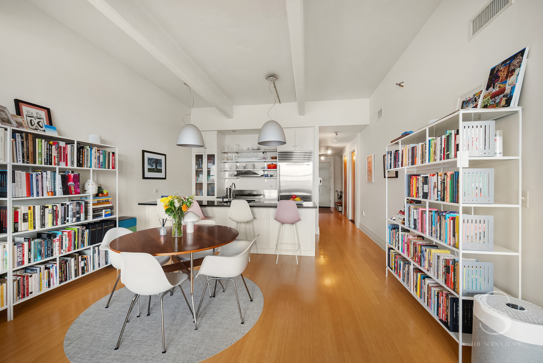 70 Washington Street, Unit 8H Brooklyn, NY 11201 - Photo 4 of 15 a living room with lots of furniture and a book shelf