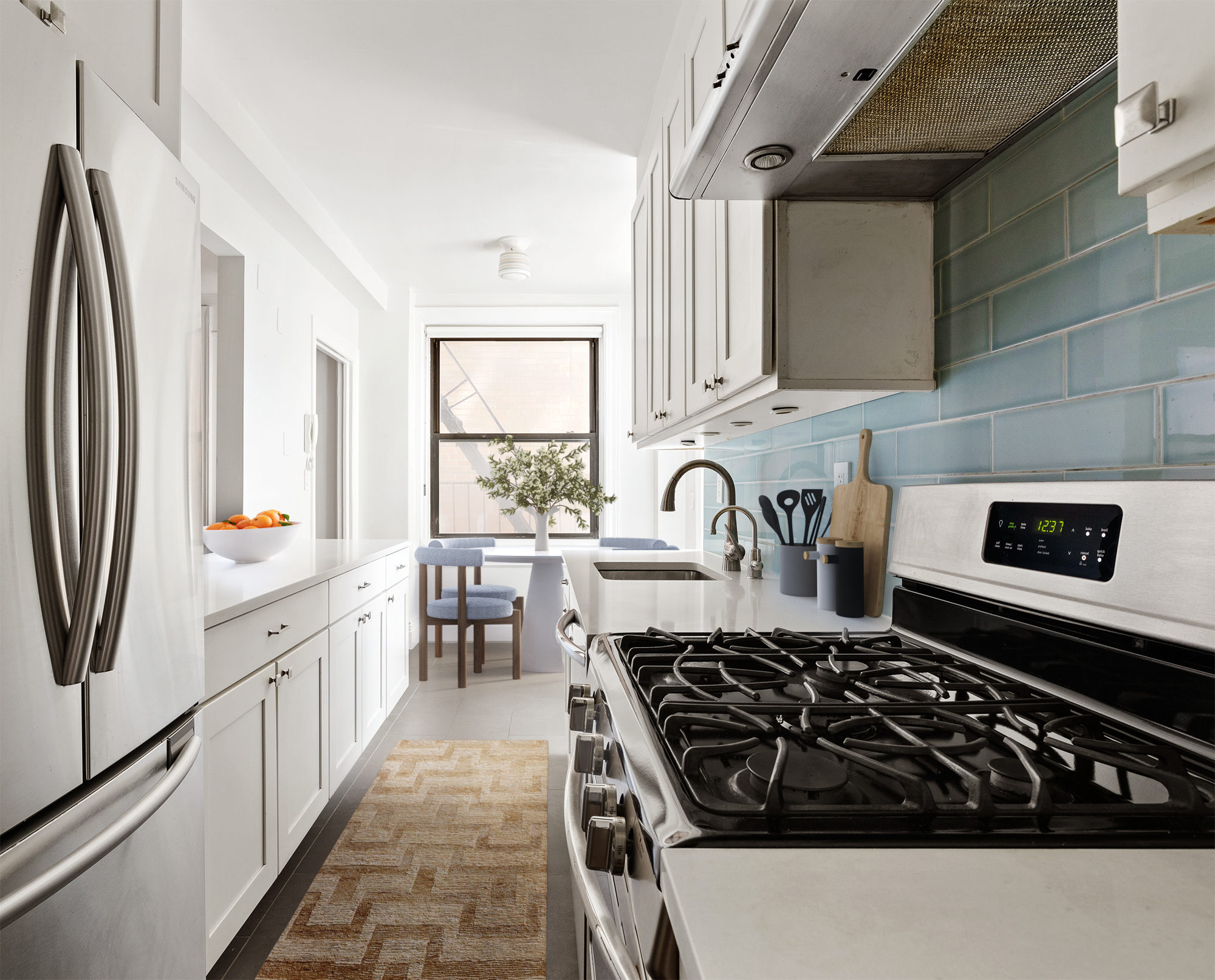 395 Riverside Drive, Unit 7F Manhattan, NY 10025 - Photo 5 of 10 a kitchen with stainless steel appliances a stove a sink and a refrigerator
