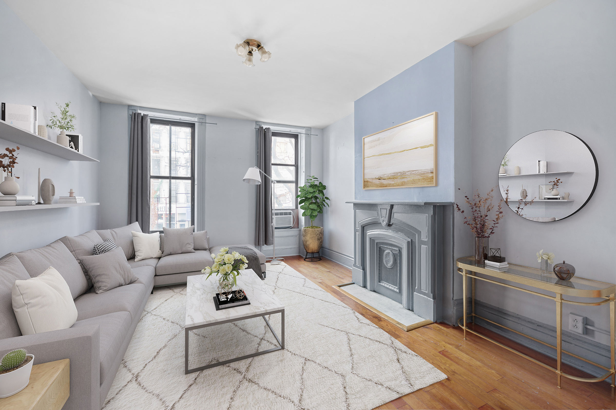 a living room with furniture a fireplace and a flat screen tv