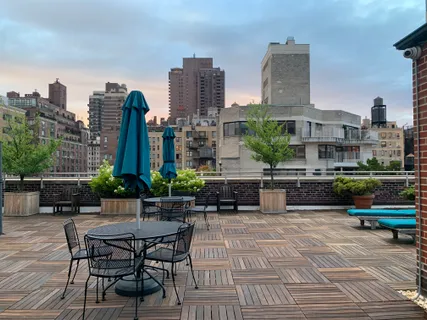 a view of a dinning table and chairs in patio