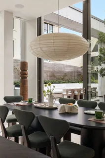 a dining room with furniture and window