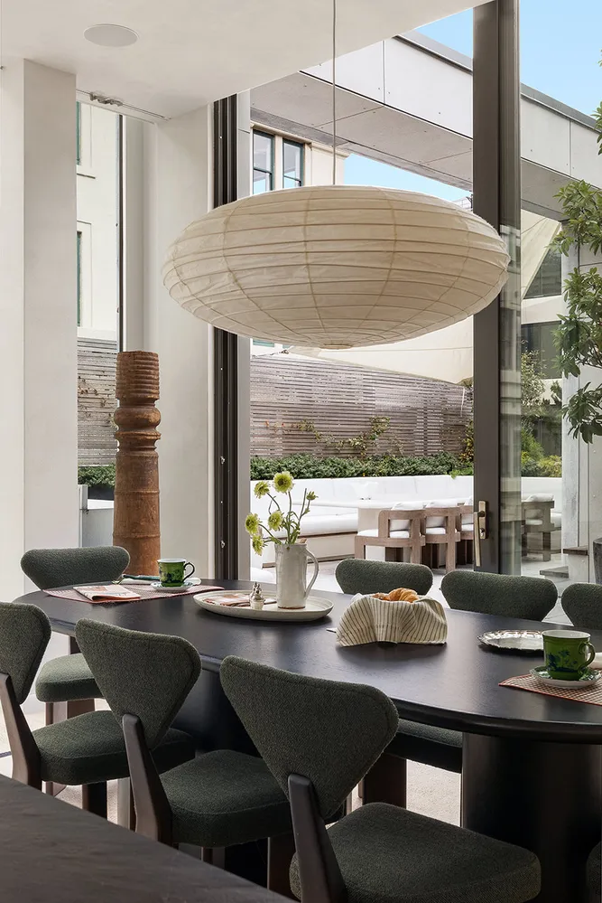 a dining room with furniture and window