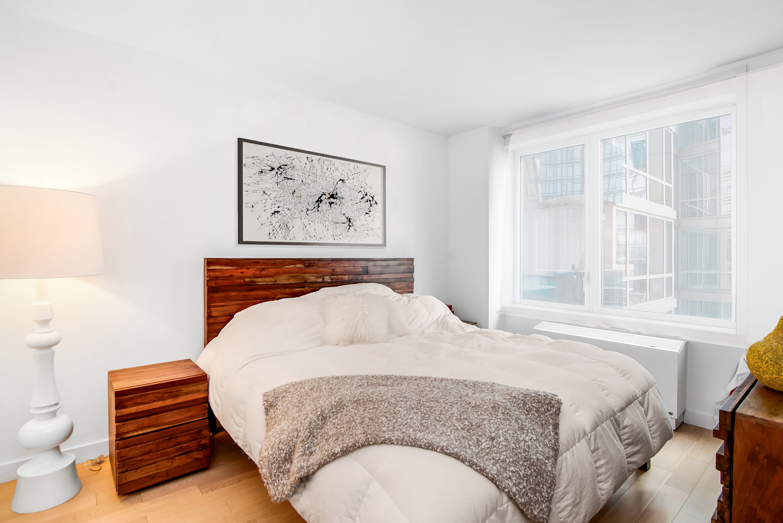 22 North 6th Street, Unit 7A Brooklyn, NY 11249 - Photo 3 of 14 a bedroom with a bed and a window