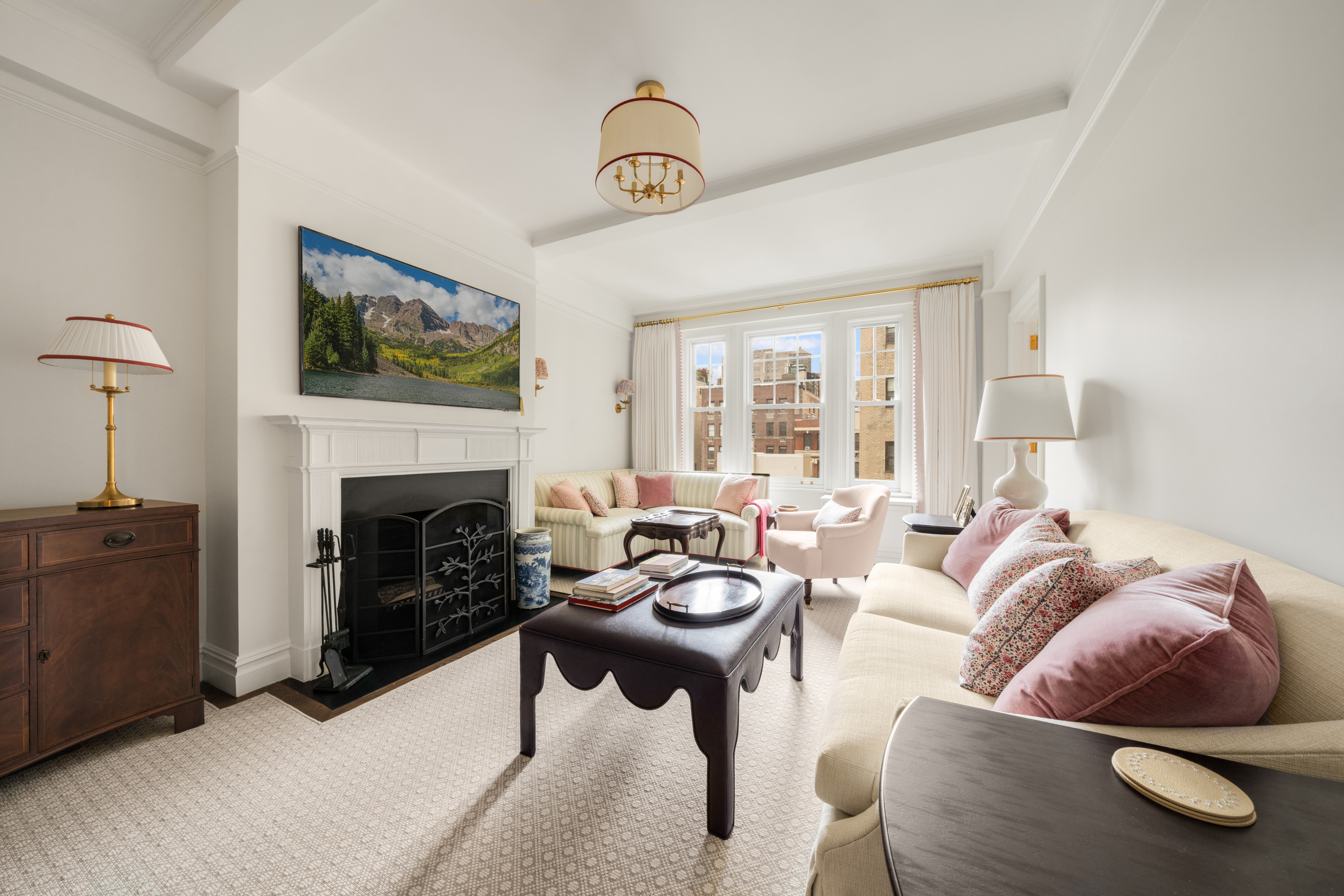 108 East 82nd Street, Unit 7C Manhattan, NY 10028 - Photo 1 of 9 a living room with furniture and a fireplace