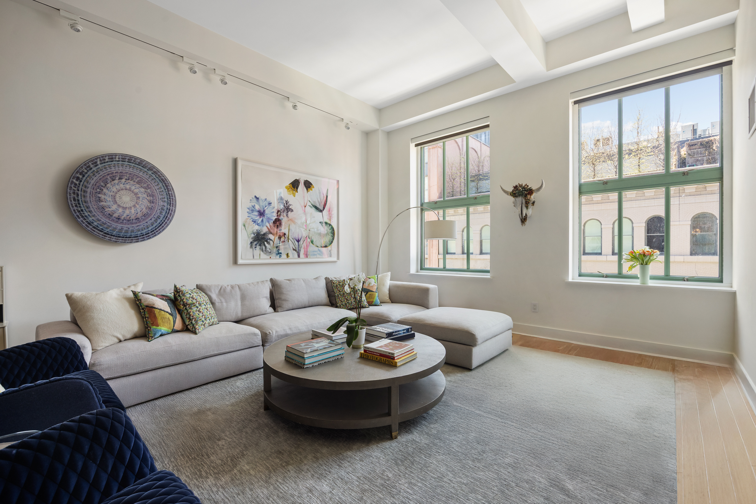 415 Greenwich Street, Unit 5D Manhattan, NY 10013 - Photo 3 of 16 a living room with furniture and a large window