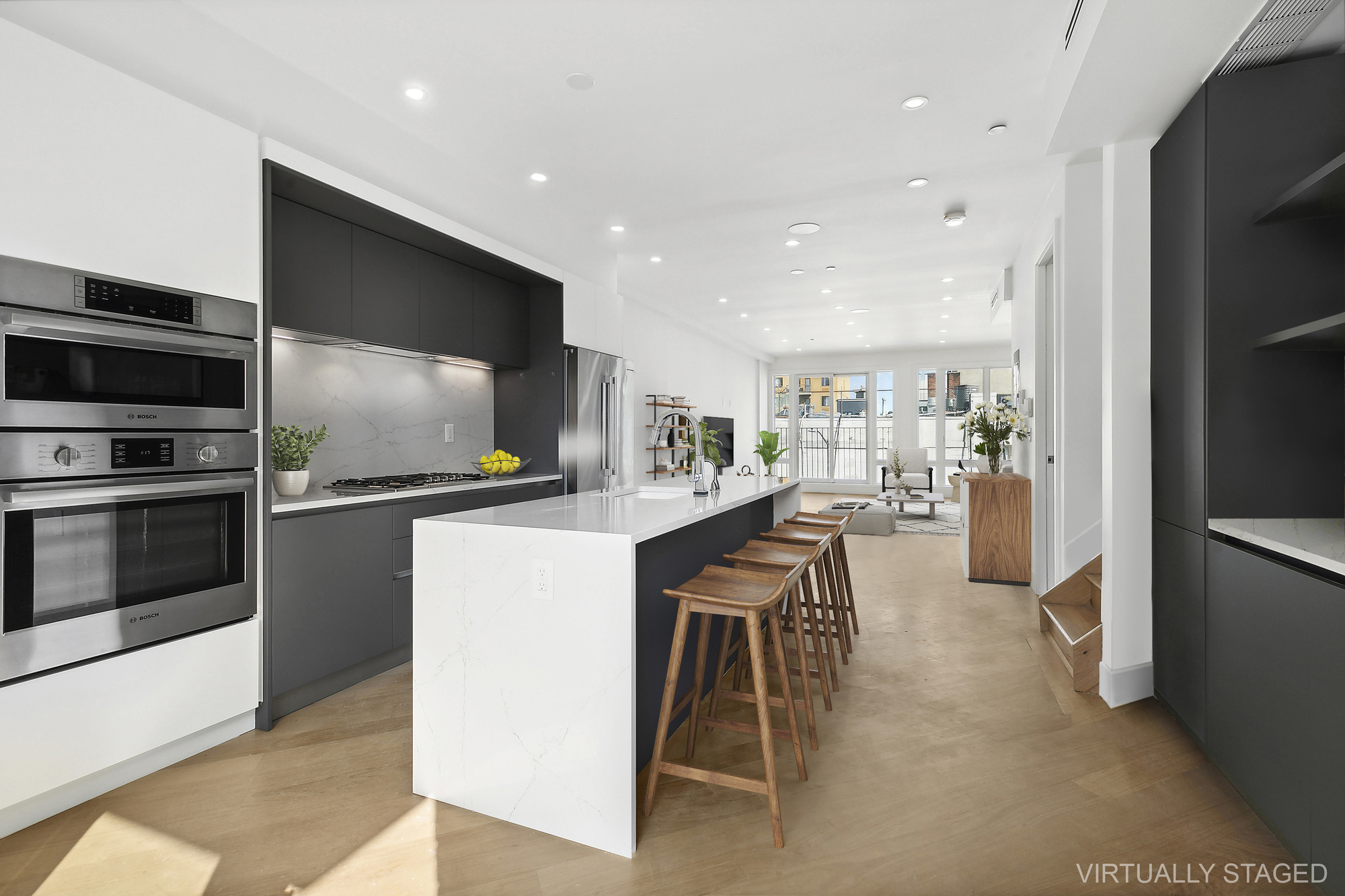 483 Hart Street, Unit 2 Brooklyn, NY 11221 - Photo 2 of 17 a kitchen with stainless steel appliances kitchen island granite countertop a refrigerator and a stove top oven
