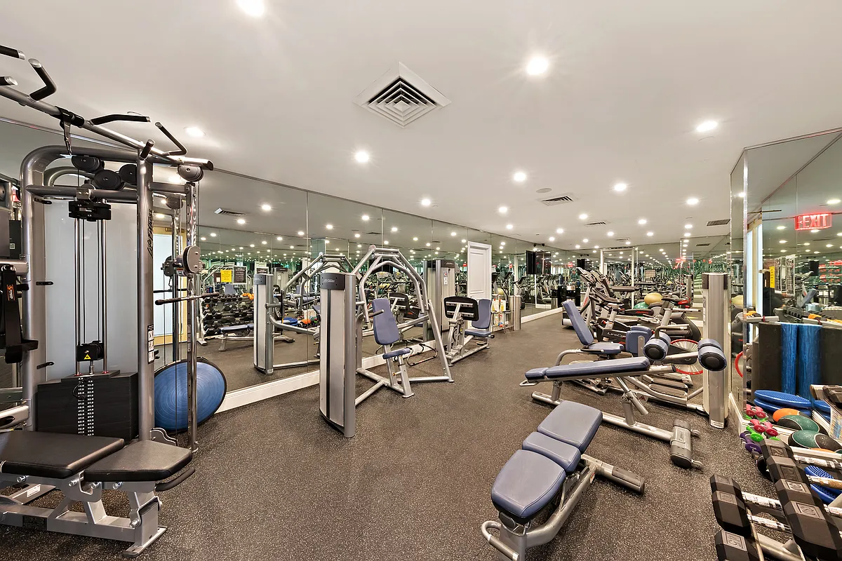 351 East 51st Street, Unit PH5B Manhattan, NY 10022 - Photo 7 of 13 a view of a room with gym equipment