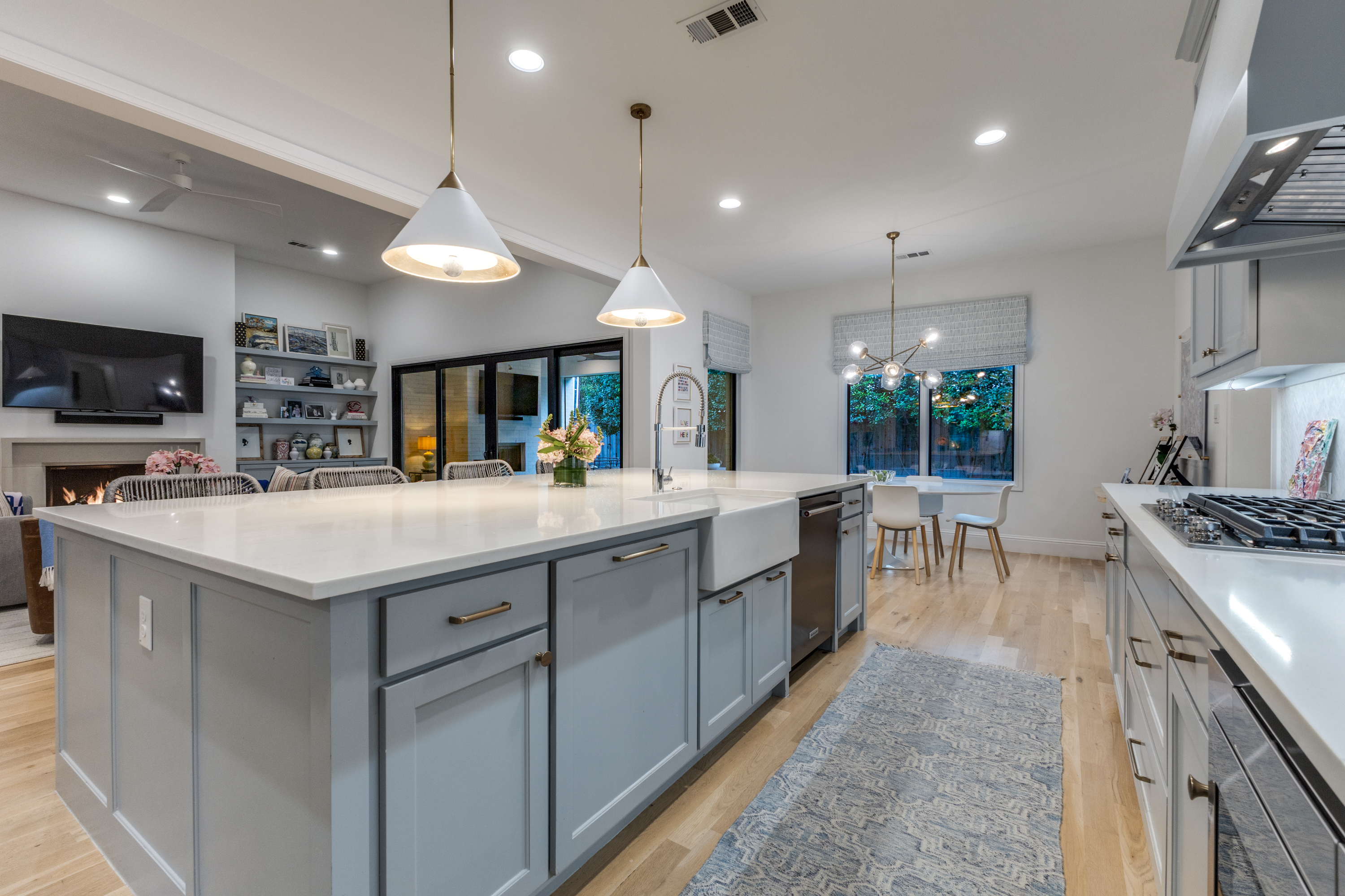4042 Dunhaven Road Dallas, TX 75220 - Photo 13 of 34 a kitchen with kitchen island granite countertop a sink a counter top space appliances and cabinets