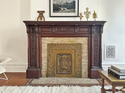 a view of a fireplace with wooden floor