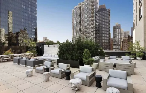 a outdoor space with lots of white furniture