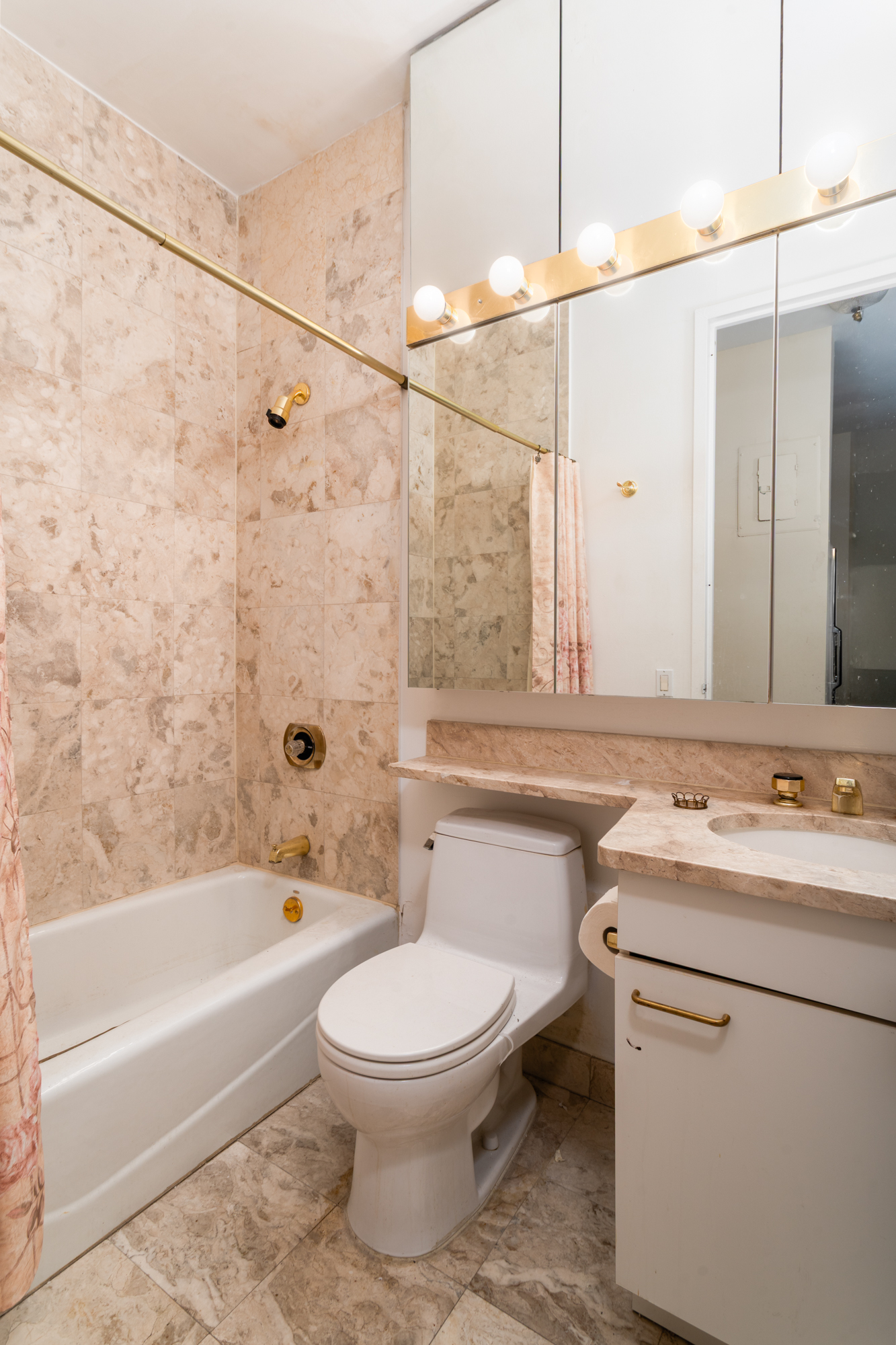 524 East 72nd Street, Unit 31F Manhattan, NY 10021 - Photo 6 of 15 a bathroom with a sink toilet and shower