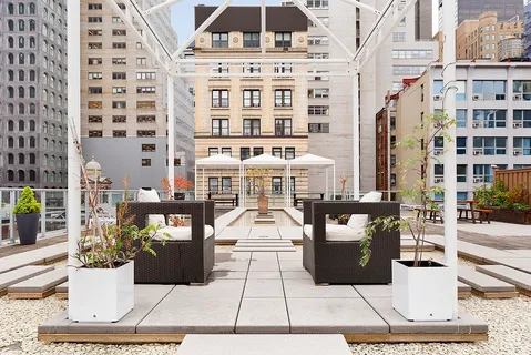 a picture of a building with a bench