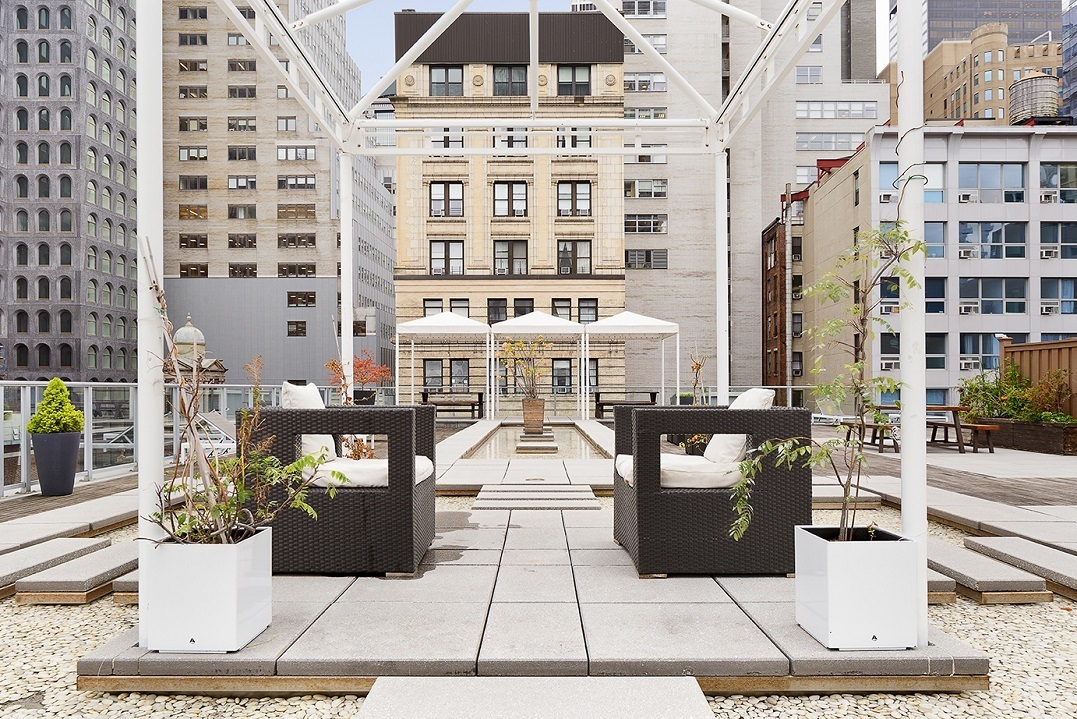 111 Fulton Street, Unit 308 Manhattan, NY 10038 - Photo 9 of 13 a picture of a building with a bench