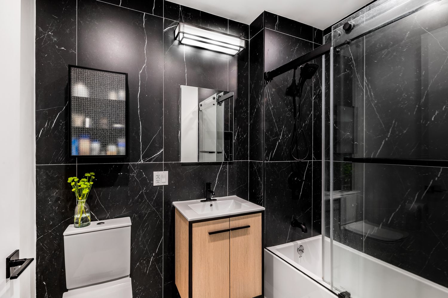 64 Stanhope Street, Unit 3B Brooklyn, NY 11221 - Photo 4 of 5 a bathroom with a sink and a shower