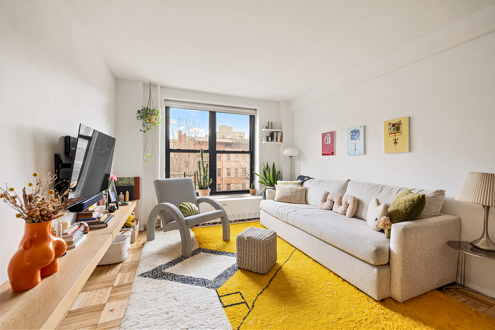 a living room with furniture and a flat screen tv