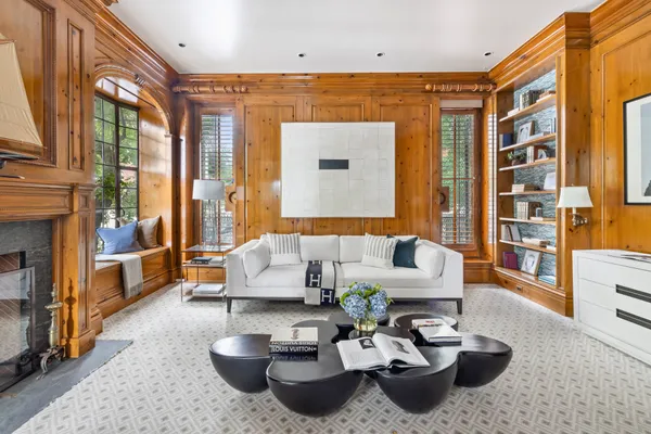 a living room with furniture and a fireplace