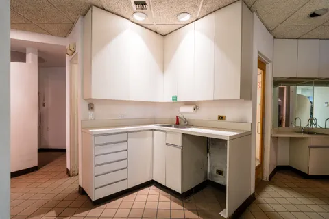 a kitchen with stainless steel appliances granite countertop a sink and a stove