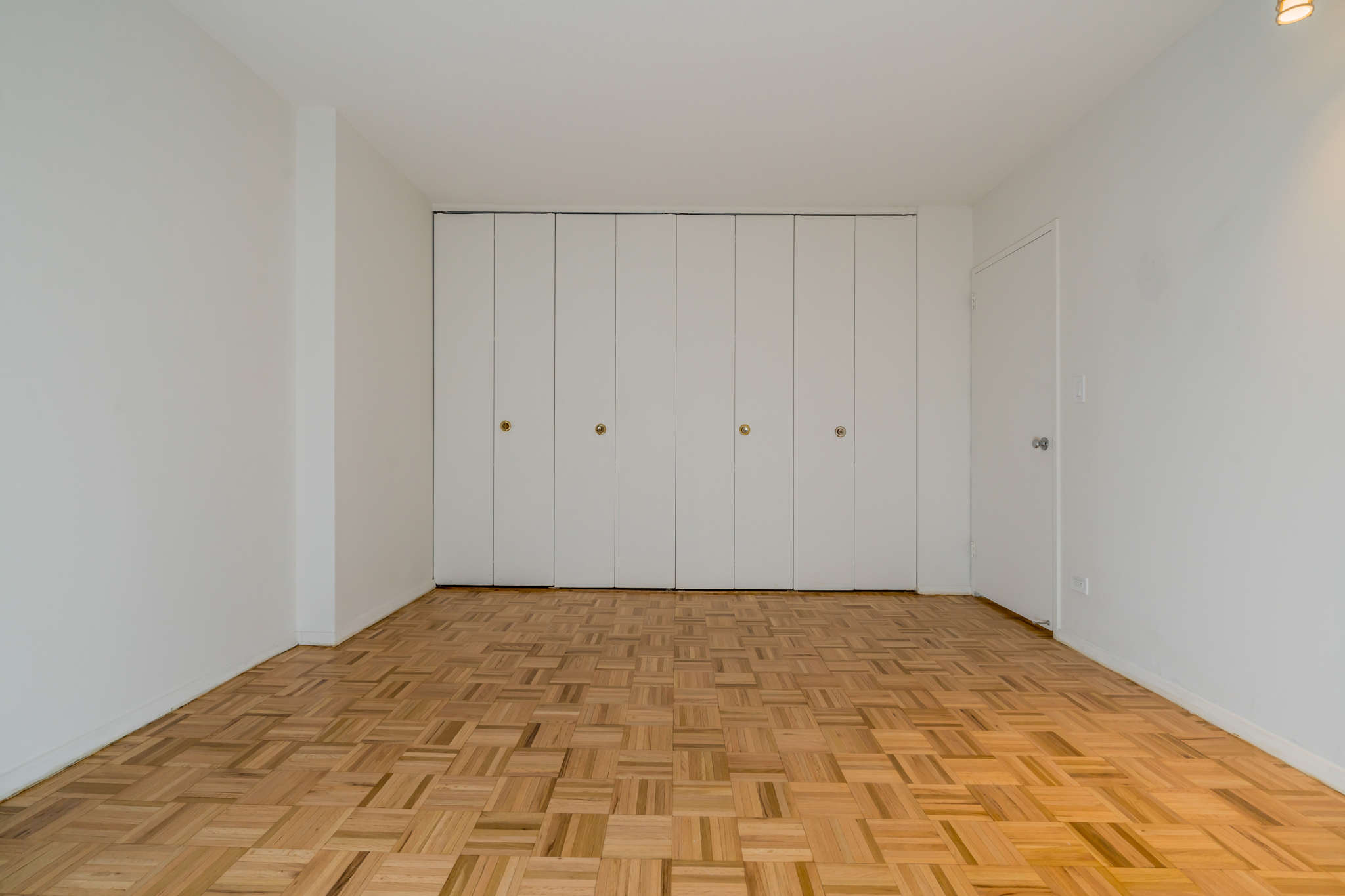 1641 3rd Avenue, Unit 24D Manhattan, NY 10128 - Photo 2 of 7 a view of a room with an empty room