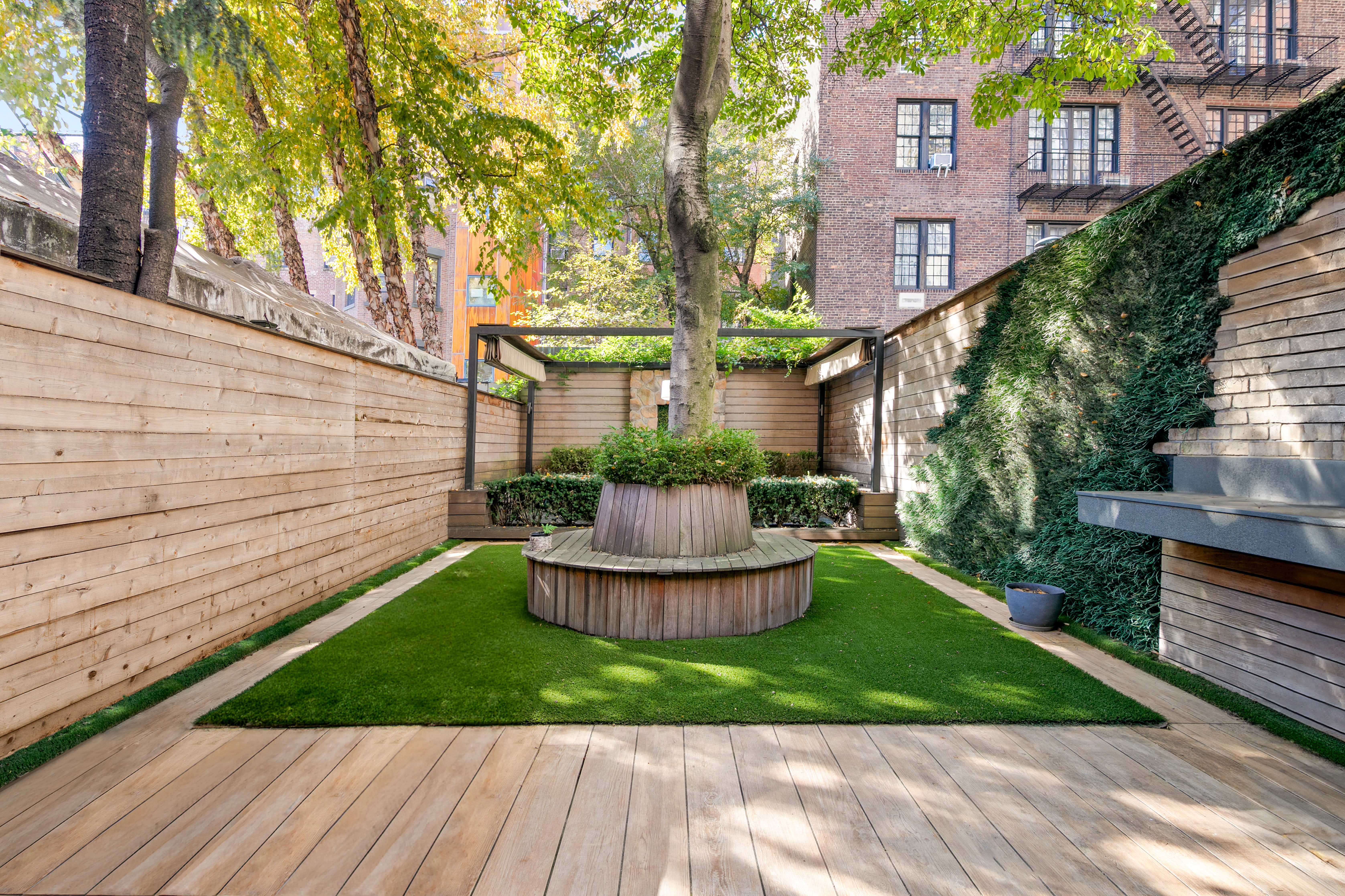 152 West 13th Street Manhattan, NY 10011 - Photo 6 of 28 a view of a house with a yard and a garden