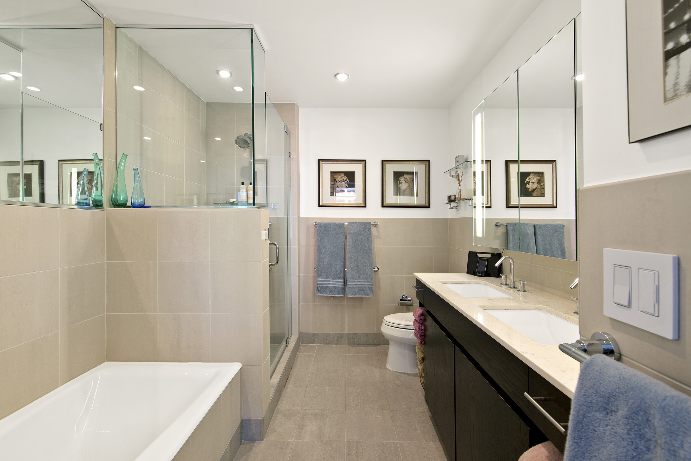 1 Northside Piers, Unit 25D Brooklyn, NY 11249 - Photo 9 of 19 a bathroom with a sink a toilet and shower