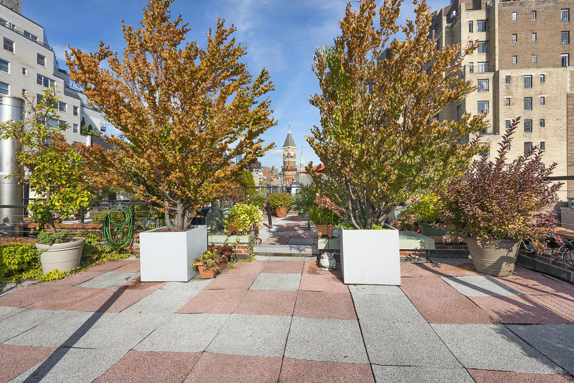 140 West 10th Street, Unit BTW Manhattan, NY 10014 - Photo 6 of 8 a wooden bench sitting in front of a building