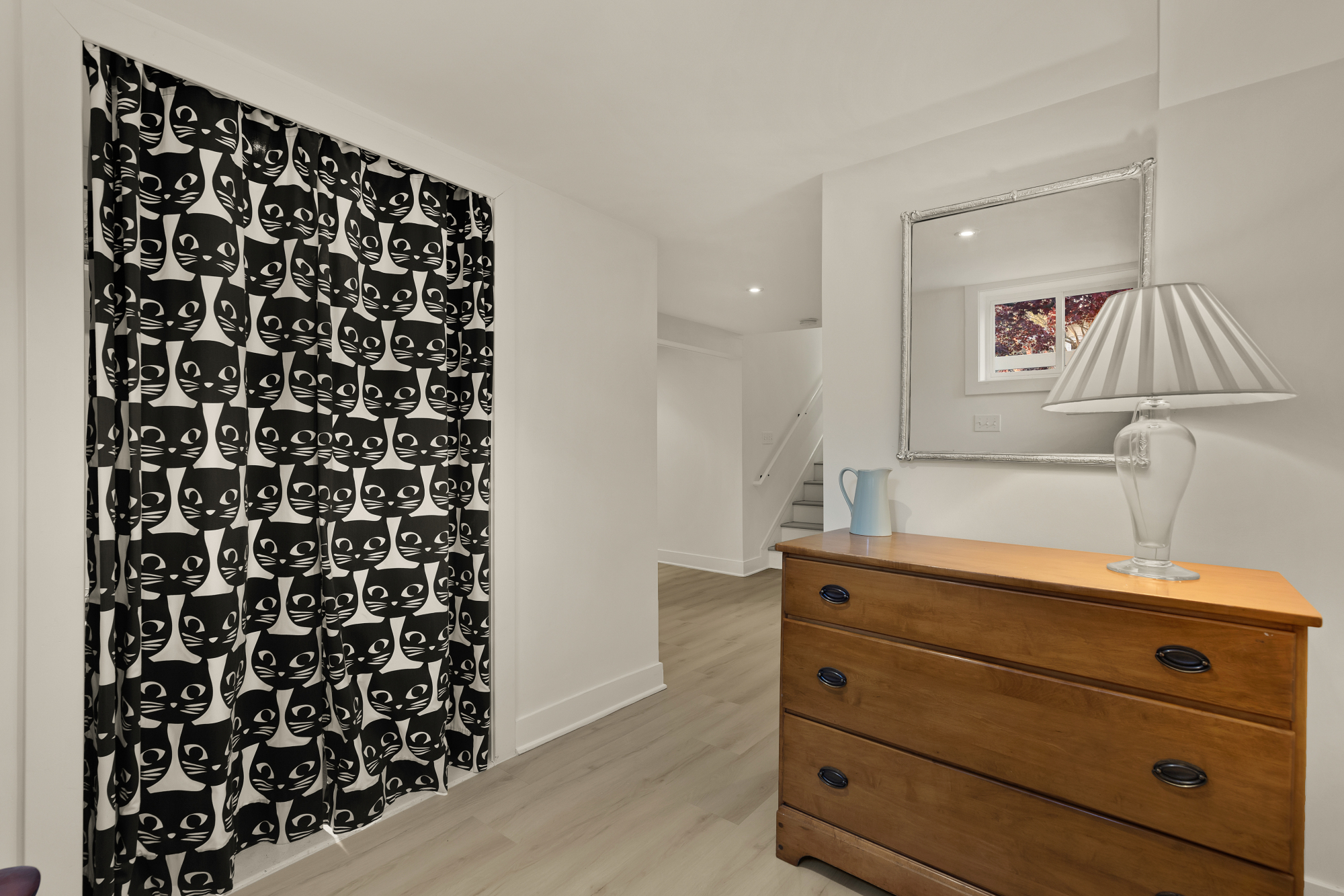 6815 Delaware Street Chevy Chase, MD 20815 - Photo 26 of 34 a view of a dresser with wooden floor