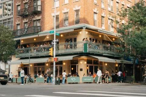 a view of a building and a people on a street