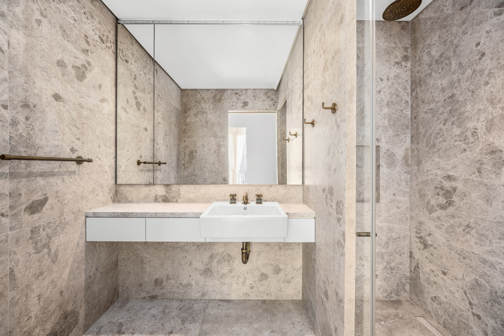 527 West 27th Street, Unit 3C Manhattan, NY 10001 - Photo 11 of 14 a bathroom with a sink and a mirror