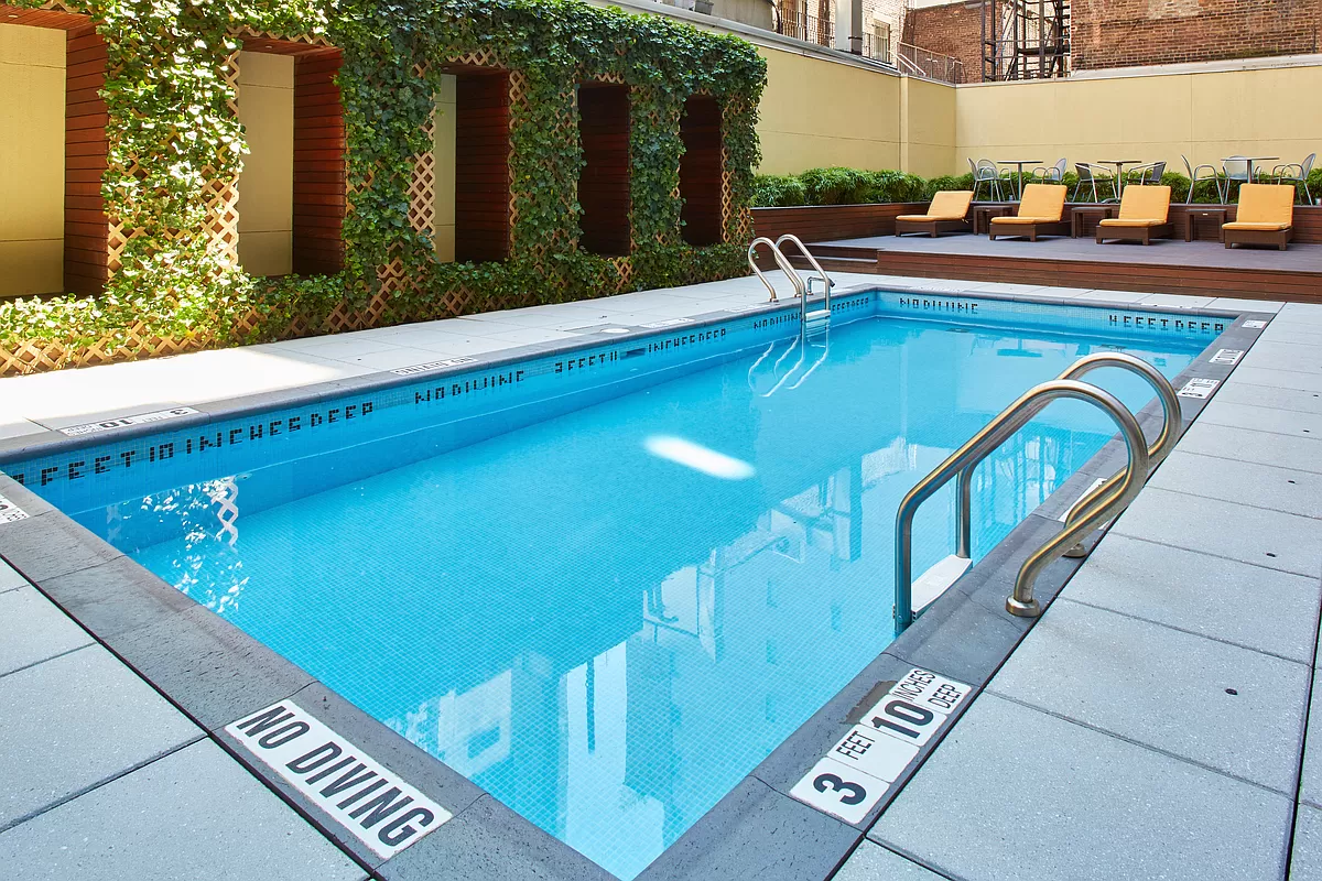 133 West 22nd Street, Unit 12B Manhattan, NY 10011 - Photo 8 of 12 a view of swimming pool with chairs