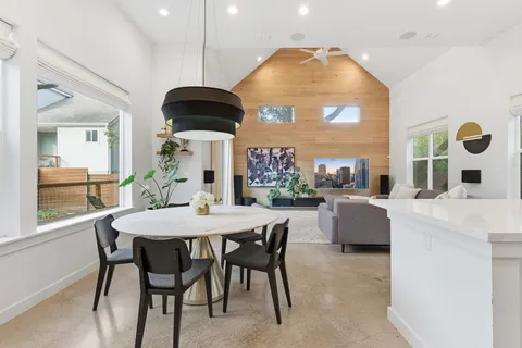 a dining room with a table and chairs