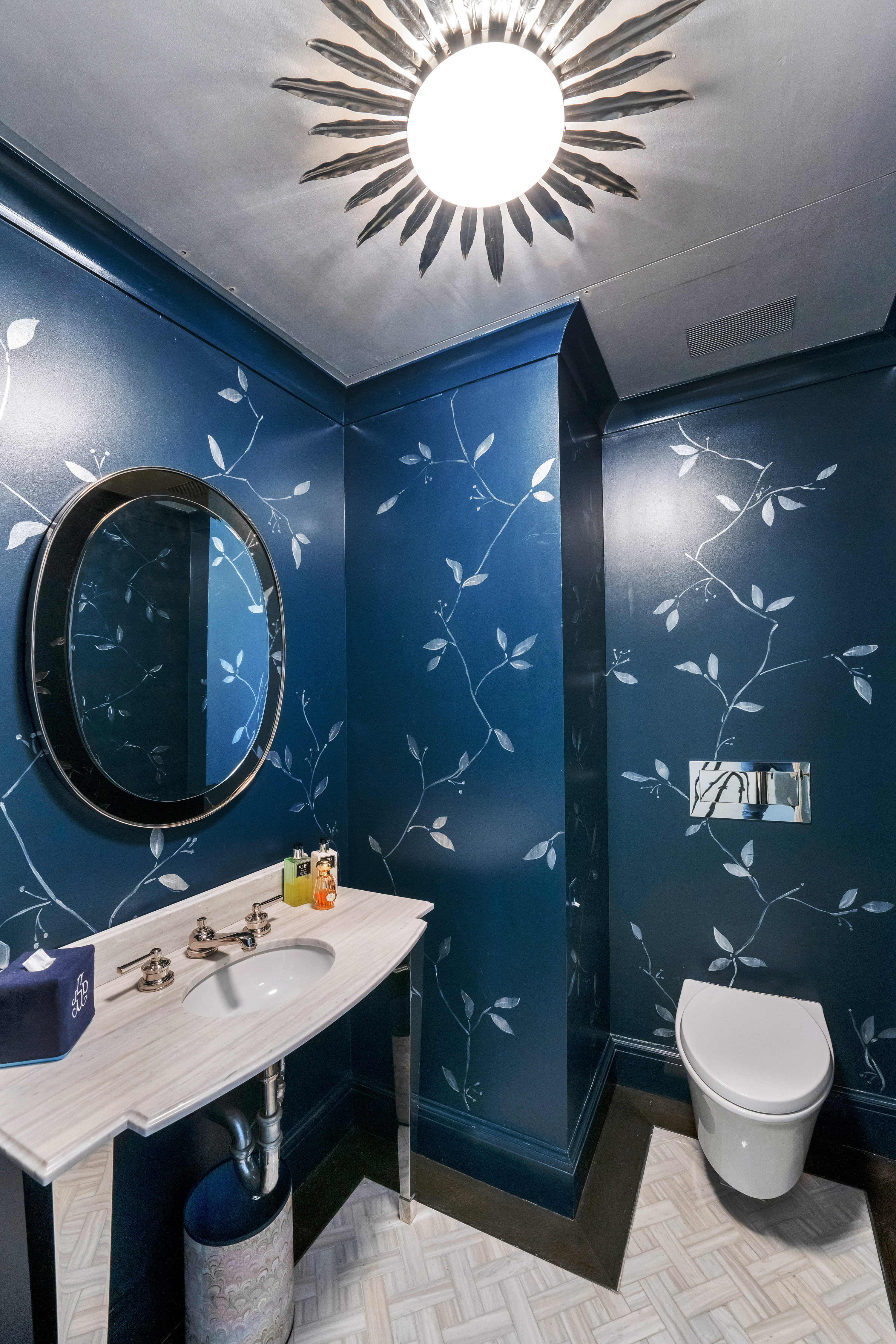 850 Park Avenue, Unit 9C Manhattan, NY 10075 - Photo 8 of 14 a bathroom with a toilet a sink and mirror