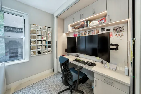 a view of a workspace with furniture