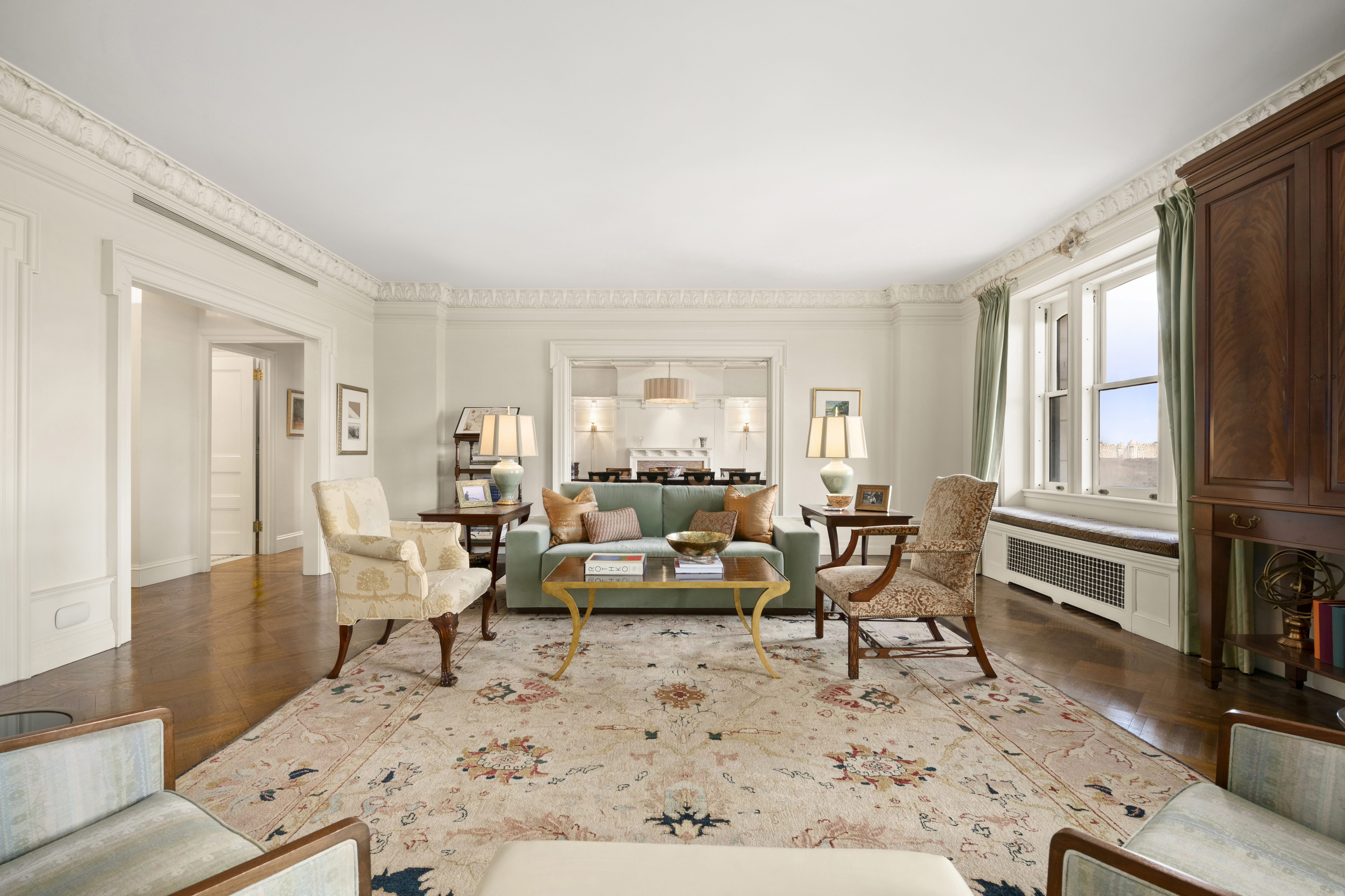 151 Central Park West, Unit 11NORTH Manhattan, NY 10023 - Photo 2 of 19 a living room with furniture large window and wooden floor