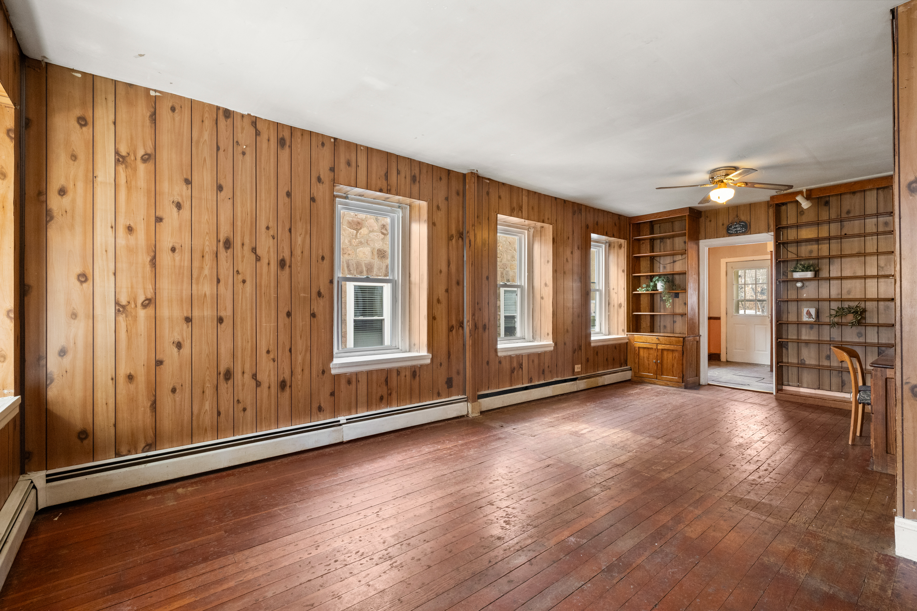 458 Renfrew Avenue Ambler, PA 19002 - Photo 17 of 32 an empty room with wooden floor and windows