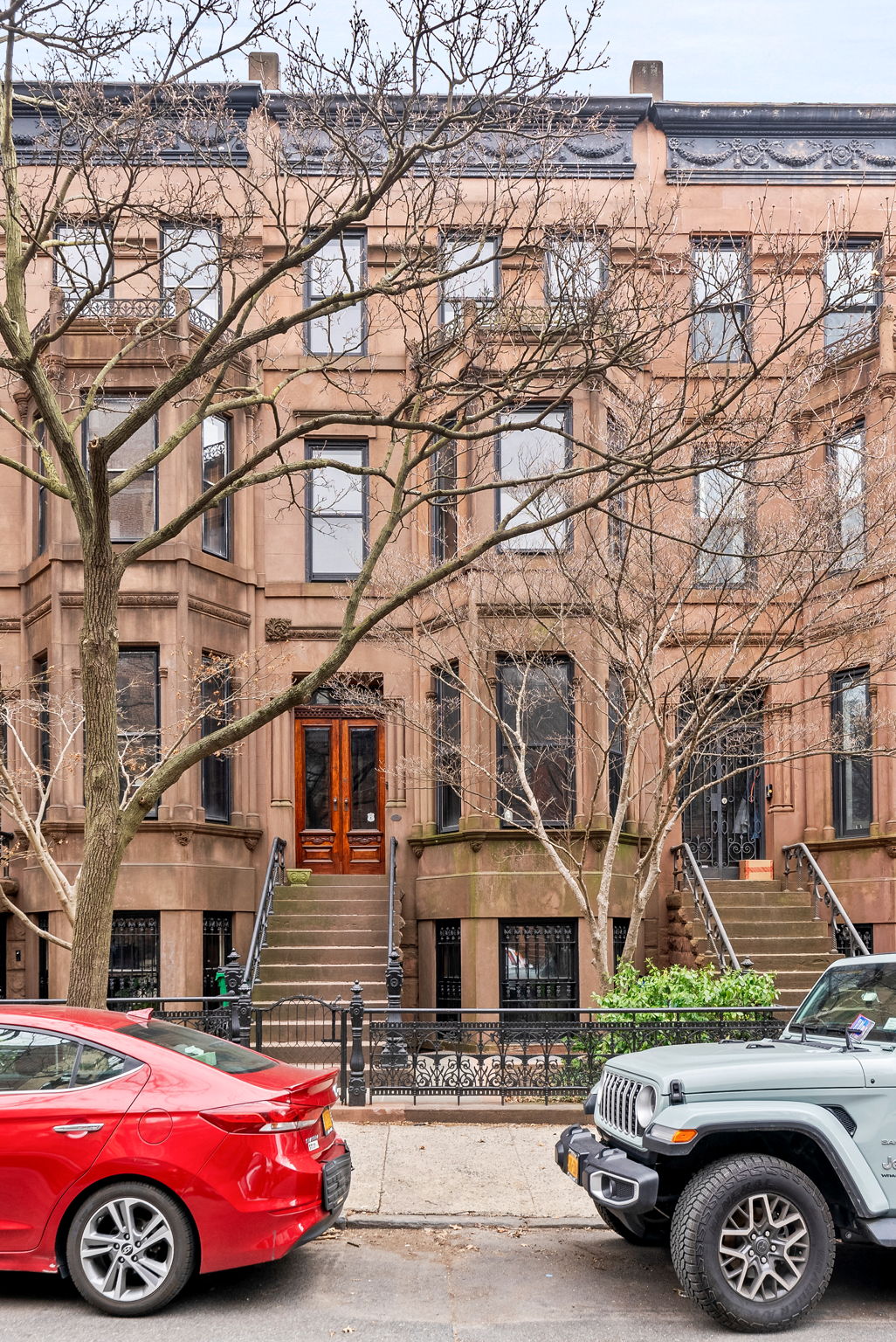 694 10th Street, Unit 2 Brooklyn, NY 11215 - Photo 21 of 22 a front view of a residential apartment building with parking space
