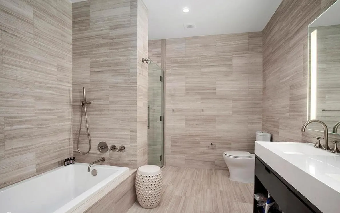 250 West Street, Unit 3F Manhattan, NY 10013 - Photo 7 of 11 a bathroom with a sink a toilet and bathtub