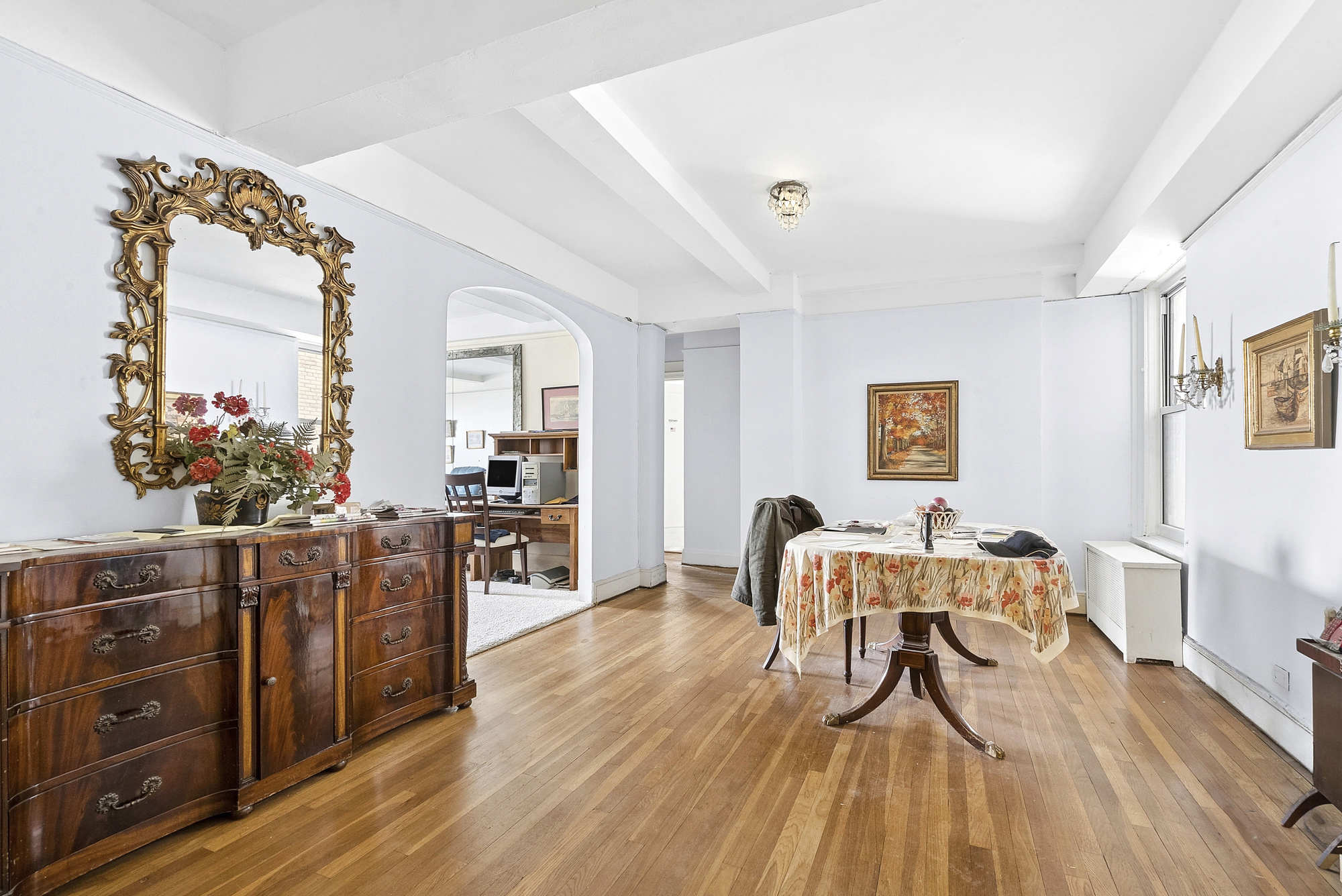 12 West 96th Street, Unit 9A Manhattan, NY 10025 - Photo 3 of 14 a living room with furniture and wooden floor