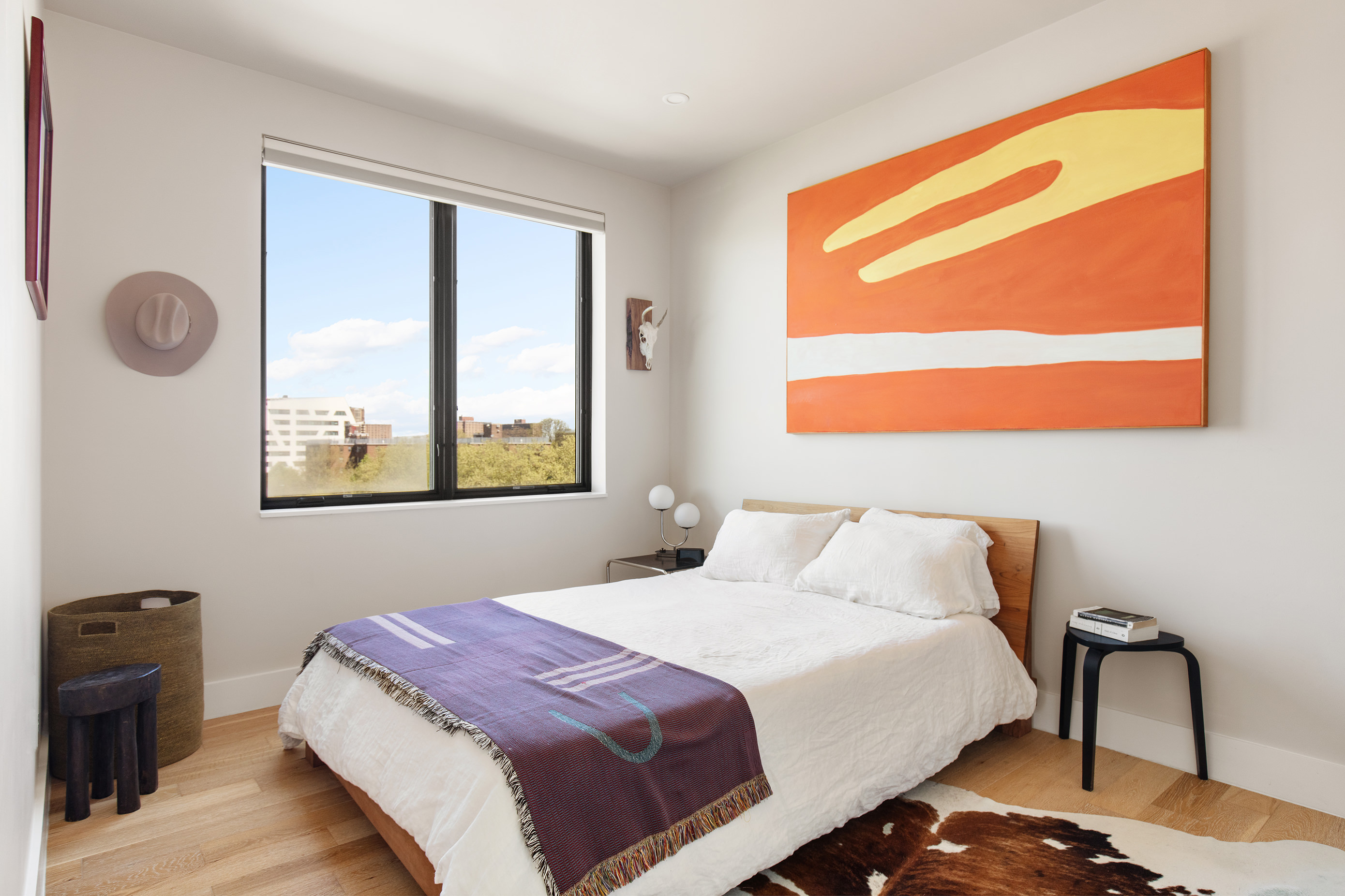 707 Willoughby Avenue, Unit 6B Brooklyn, NY 11206 - Photo 8 of 17 a bedroom with a bed and wooden floor