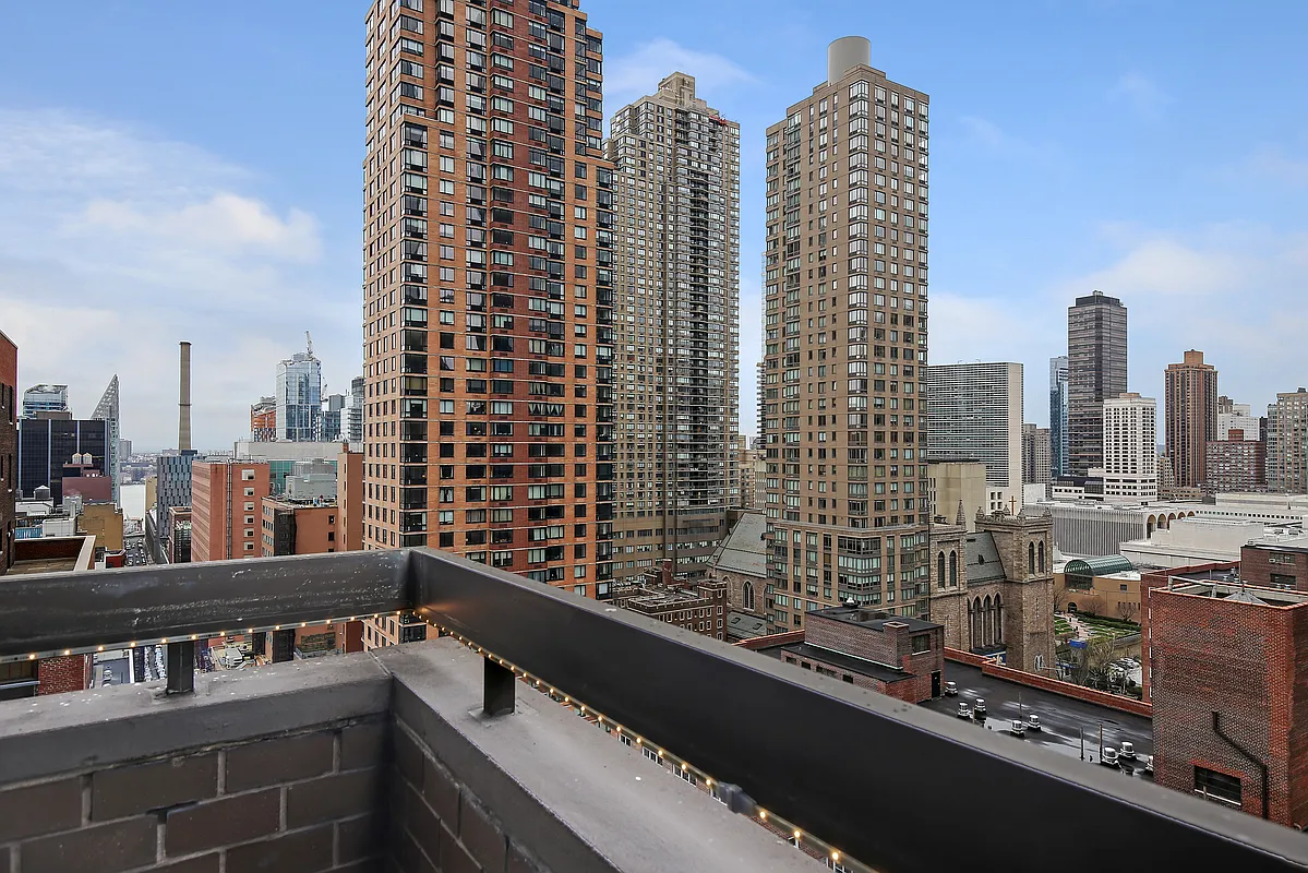 347 West 57th Street, Unit 23A Manhattan, NY 10019 - Photo 5 of 6 a view of a city with tall buildings