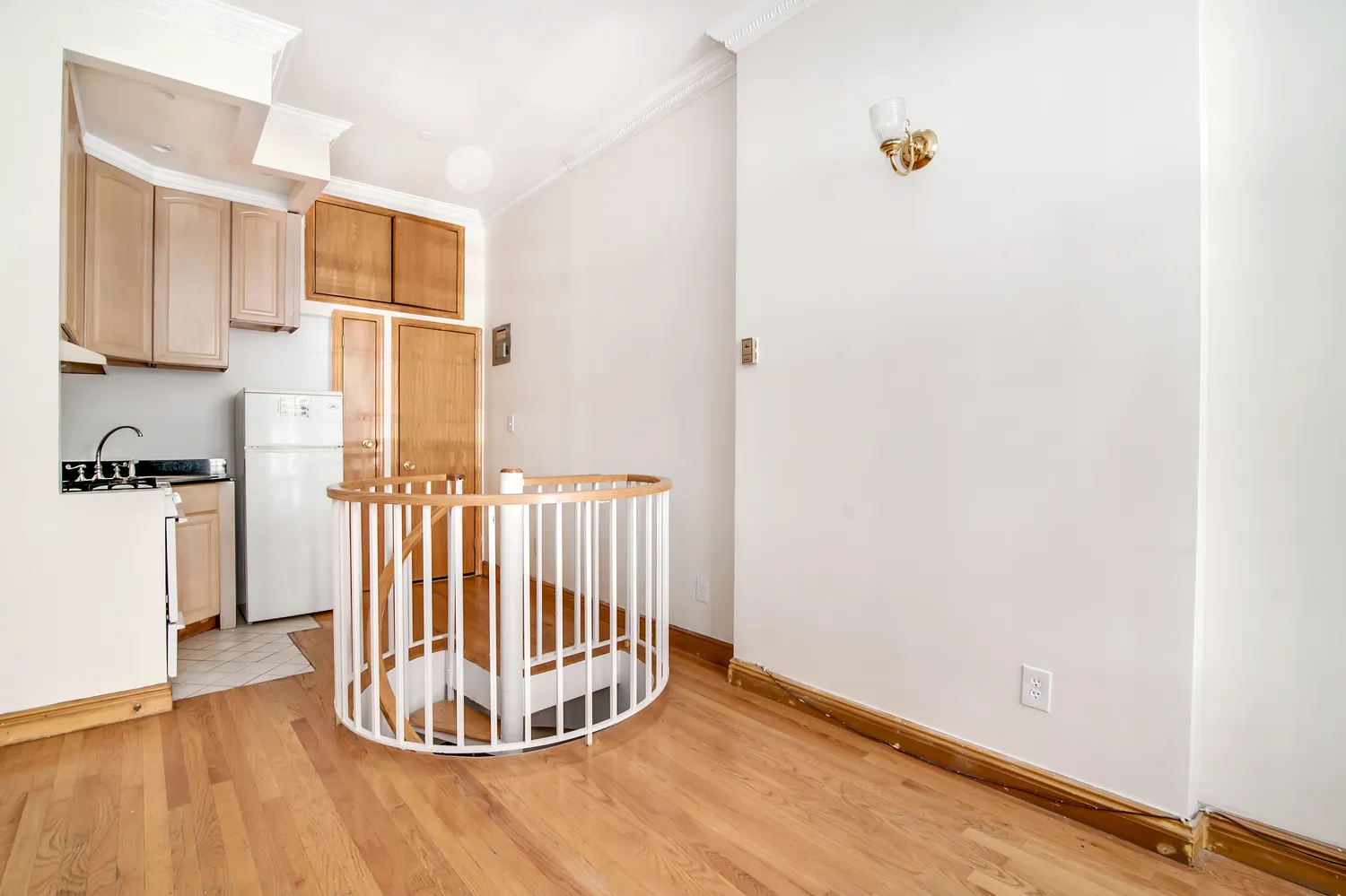 a view of a livingroom with wooden floor