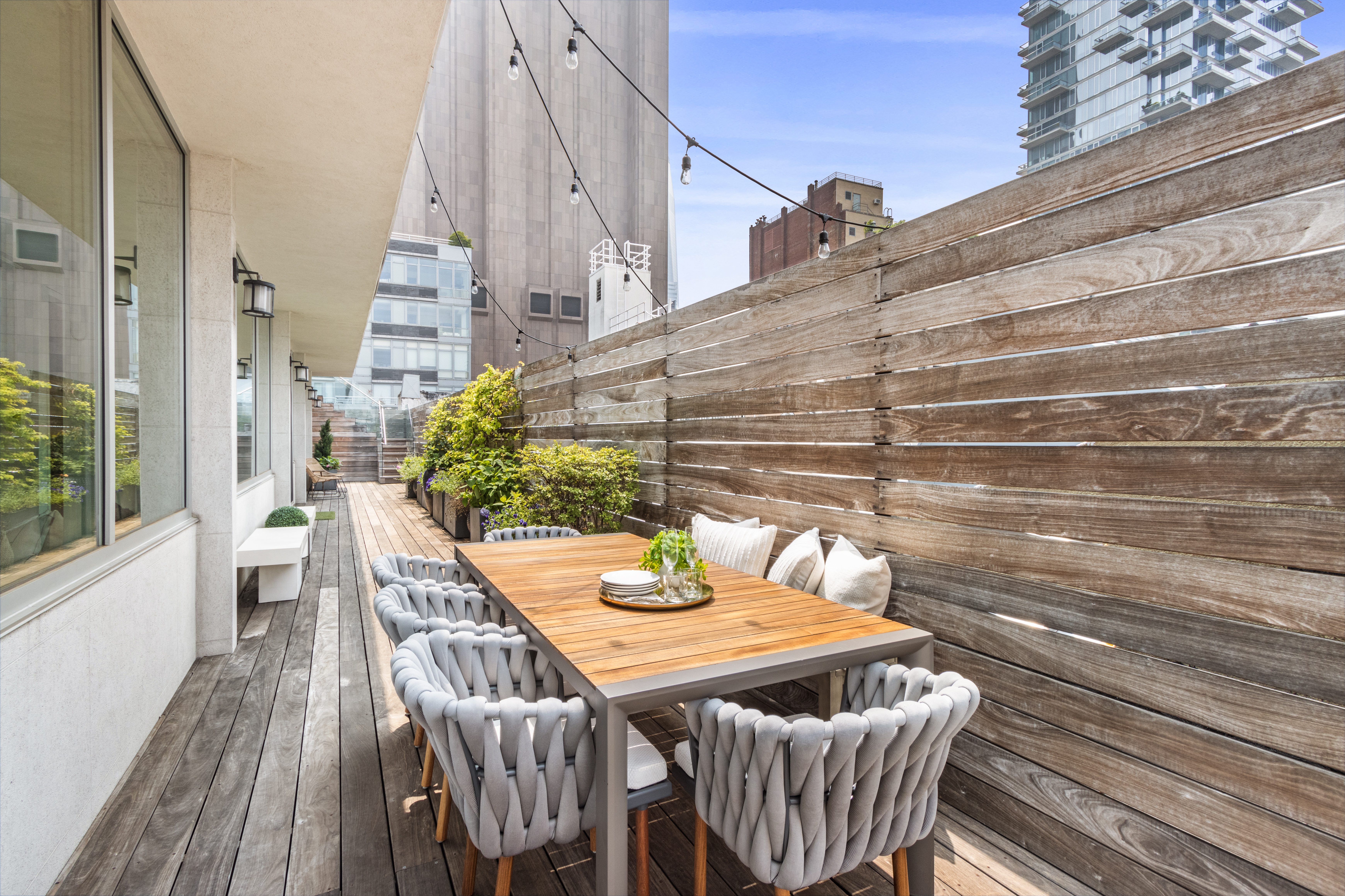 85 Leonard Street, Unit PH Manhattan, NY 10013 - Photo 22 of 27 a view of a patio with table and chairs