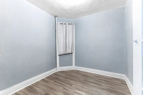 a bedroom with a bed and a table